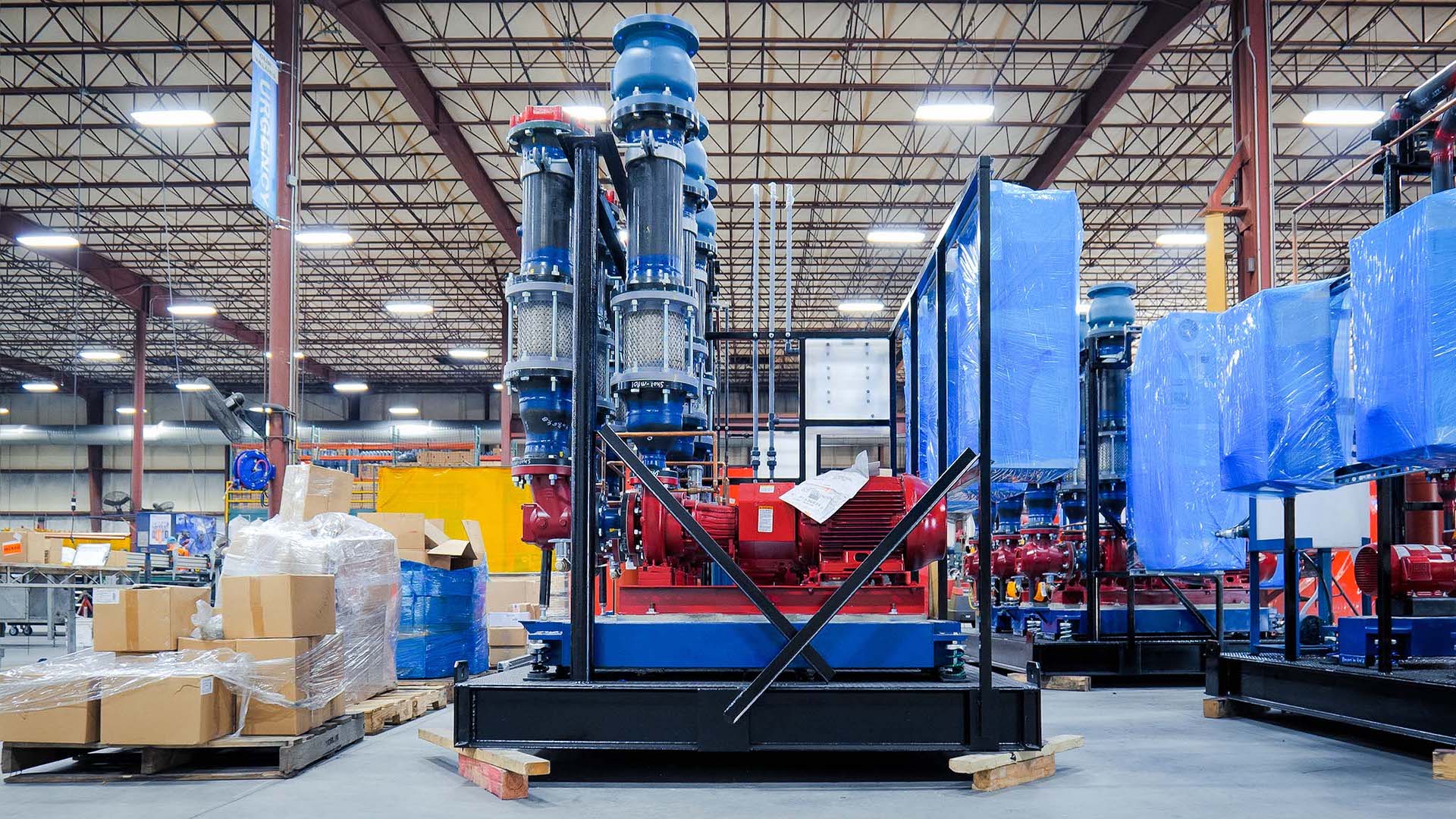 A modular process skid sits on a manufacturing floor