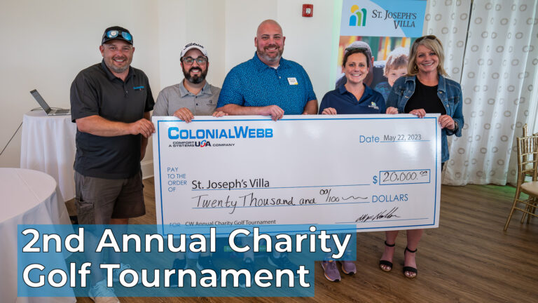 ColonialWebb and St. Joseph's Villa staff holding check of funds raised - $20,000