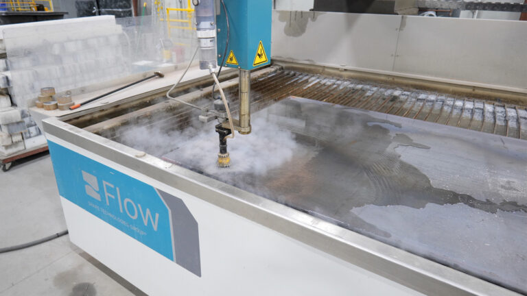 Flow mach 100 waterjet cutting machine