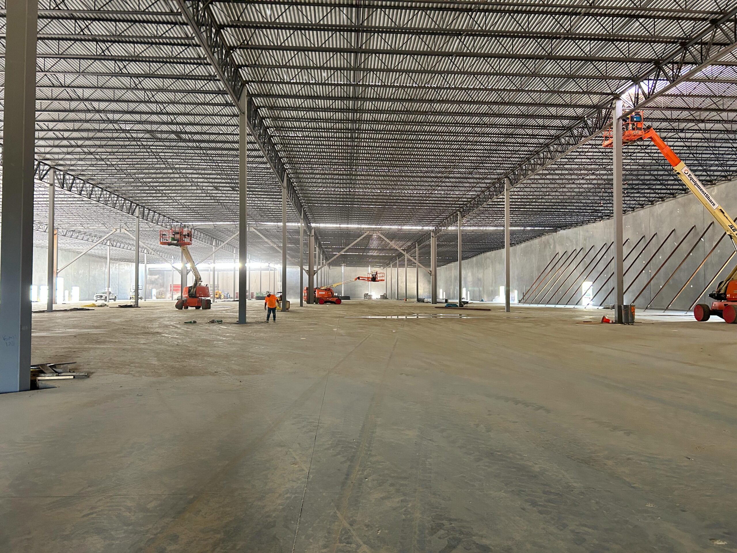 The Coca Cola warehouse under construction with roof drain installation