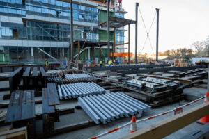 CoStar building under construction with workers walking around outside